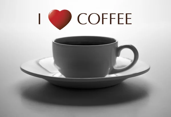 Скляна чашка і тарілка крупним планом з назвою Я люблю каву — стокове фото