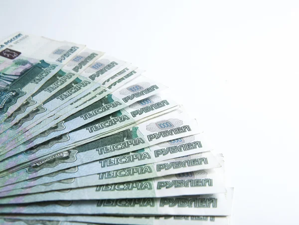 Billetes denominados 1000 rublos sobre un blanco —  Fotos de Stock