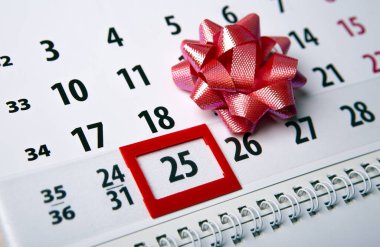 wall calendar with day 25 december and  festive bow 