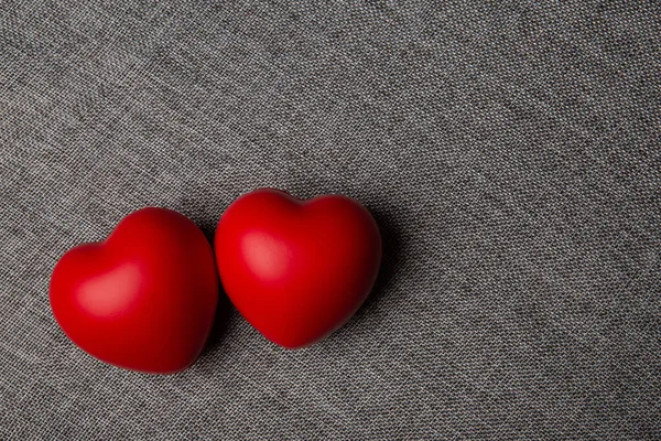 Two Large Red Hearts Textile Background — Zdjęcie stockowe