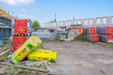view on a construction site with building materials, construction site in Rucphen, The Netherlands, 6 may, 2022