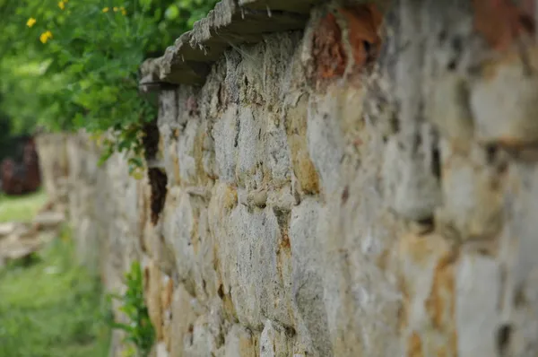 Very old stone wall on a sunny day — Stock Photo, Image