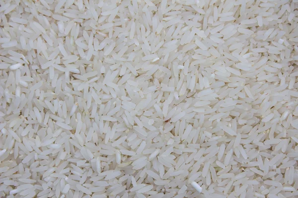 Uncooked white rice background — Stock Photo, Image
