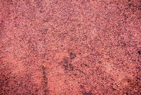 Textura grunge de una pared en ruinas en un tono rojo —  Fotos de Stock