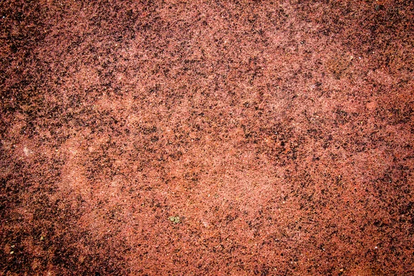 Textura grunge de una pared en ruinas en un tono rojo — Foto de Stock
