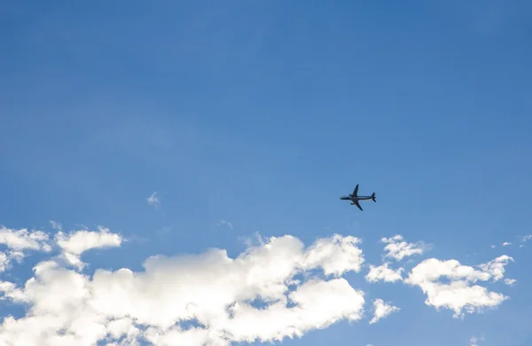 Plane crossing a cloud vignette — Stock Photo, Image