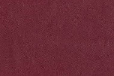 Red bright macro photo of texture of the genuine faux vegan leather. Fashion pattern and background. Leather with embossing.