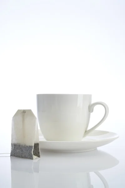 Mug of tea on a white background — Stock Photo, Image