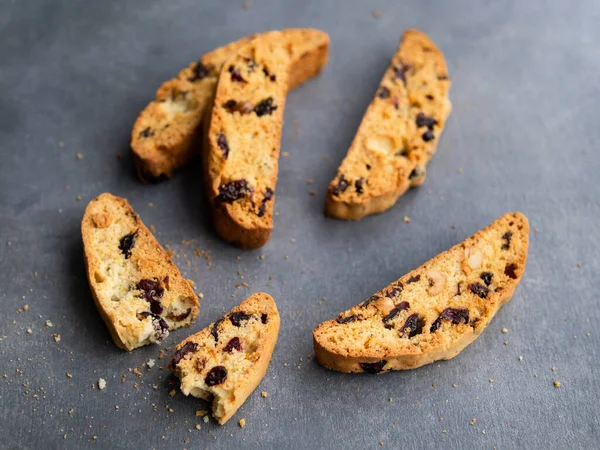 Traditional italian cookies biscotti with dried cranberry and nuts, top view, copy space