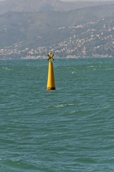 Yellow no sail metallic buoy on blue sea background — Stock Photo, Image