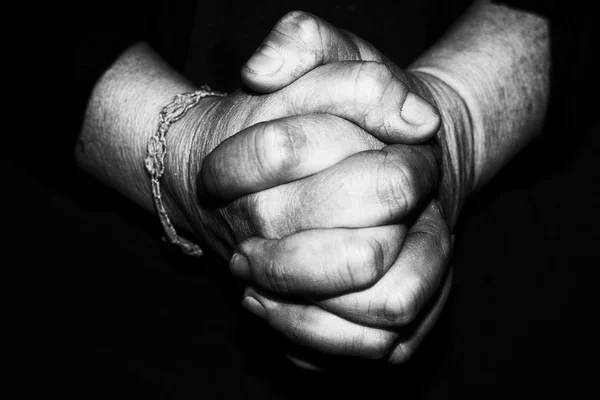 Old retired woman crossed hands Stock Photo