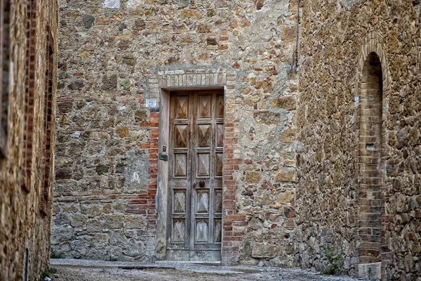 San quirico středověké domy, kamenné zdi — Stock fotografie