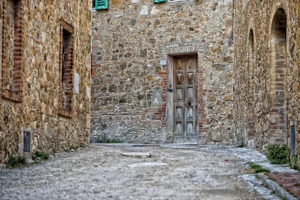 San quirico middeleeuwse huizen stenen muur — Stockfoto