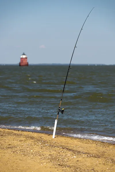 Bastón de pesca en la playa — Foto de Stock