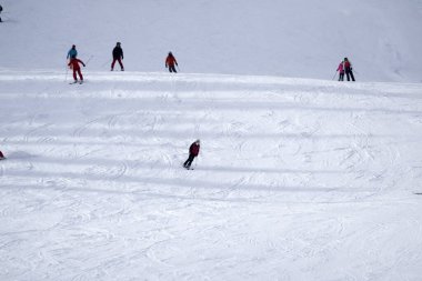 many skiers skiing in dolomites gardena valley snowy mountains 
