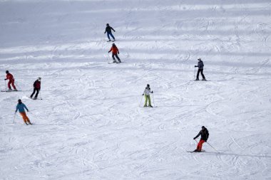 many skiers skiing in dolomites gardena valley snowy mountains 