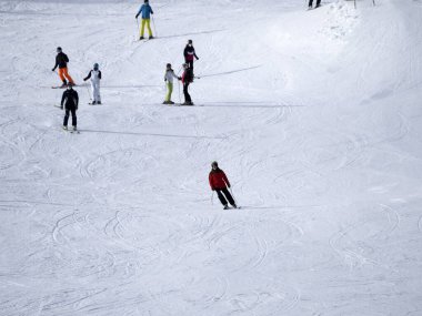 many skiers skiing in dolomites gardena valley snowy mountains 