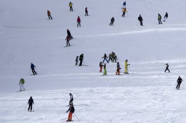 many skiers skiing in dolomites gardena valley snowy mountains 