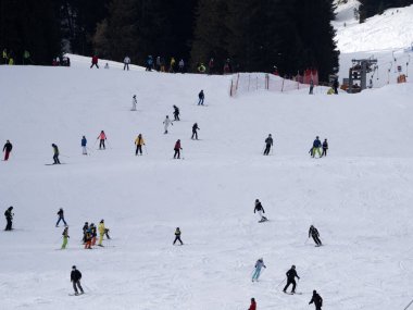 many skiers skiing in dolomites gardena valley snowy mountains 