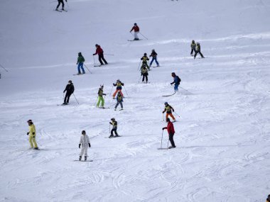 many skiers skiing in dolomites gardena valley snowy mountains 