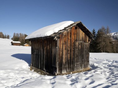 dolomites snow panorama wooden hut val badia armentara hill