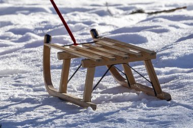wooden sledge on the snow in winter season