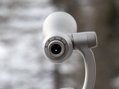 detail of Monocular in winter mountain season dolomites