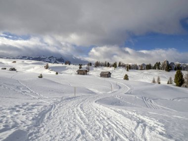 dolomites snow panorama wooden hut val badia armentarola hill