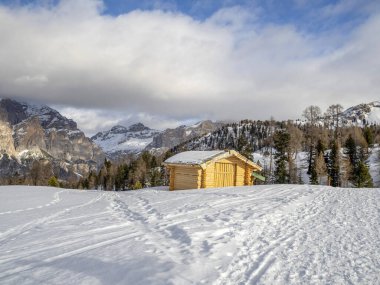 dolomites snow panorama wooden hut val badia armentarola hill
