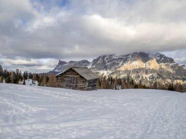 dolomites snow panorama wooden hut val badia armentarola hill