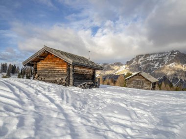 dolomites snow panorama wooden hut val badia armentarola hill