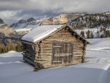 dolomites snow panorama wooden hut val badia armentarola hill