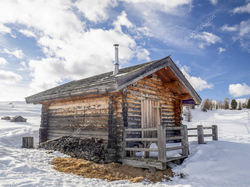 dolomites snow panorama wooden hut val badia armentarola hill