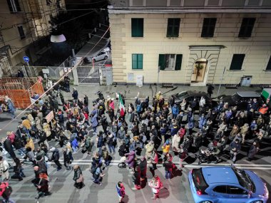 GENOA, ITALY - JANUARY 15 2022 - No green pass no vax protest in city street at night