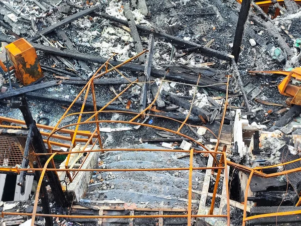 burned metal structure after fire by the sea detail