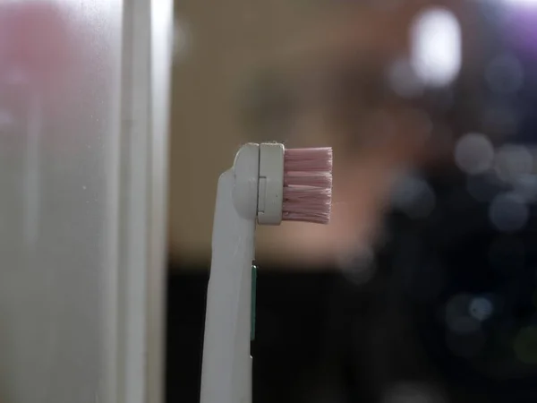 electric toothbrush rotating head macro