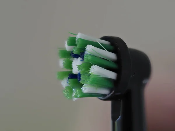 electric toothbrush rotating head macro