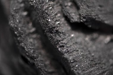 black barbecue charcoal macro detail close up