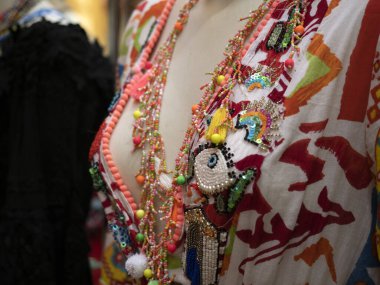 detail of embroidery oriental indian style female dress detail at the market