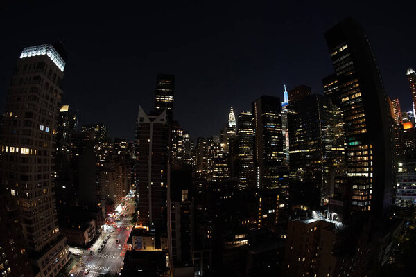 Manhattan new york city night aerial cityscape from terrace rooftop