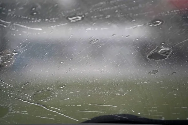 heavy rain on car windscreen wiper detail