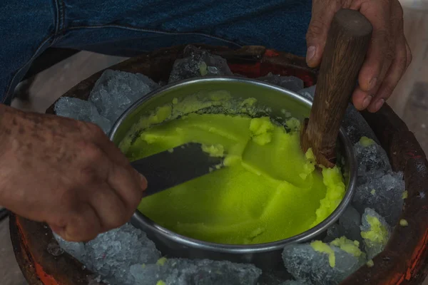 Lemon snow made by hand, you can see the hands of the craftsman making the snow