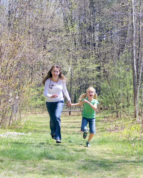 Mother and daughter in forest — Stock Photo, Image