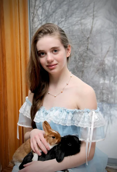 Girl with cute bunnies — Stock Photo, Image