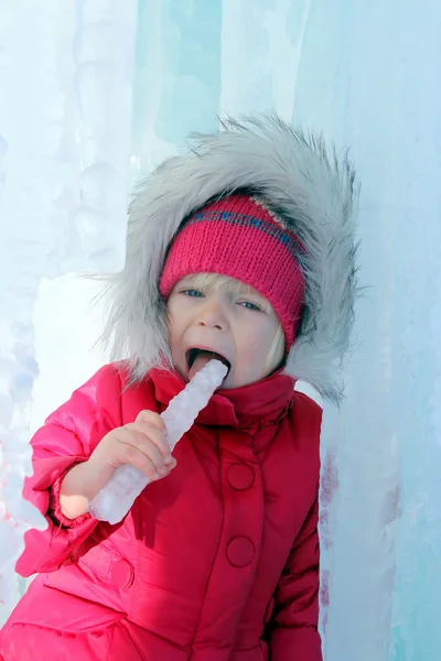 Girl licking the icicle — Stock Photo, Image