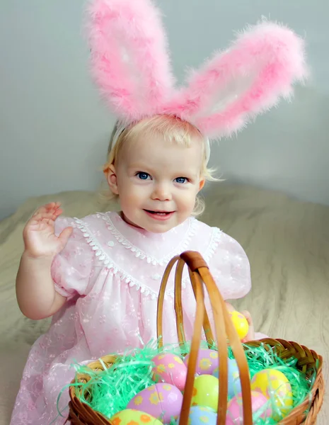 Adorable toddler girl with bunny ears and Easter eggs — Stock Photo, Image