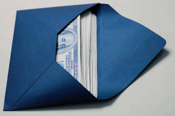 Money in an envelope. Open envelope with american dollar banknotes closeup.. Ten thousand bucks. The concept of wealth and income, corruption, bribe, savings. cash. Nobody.