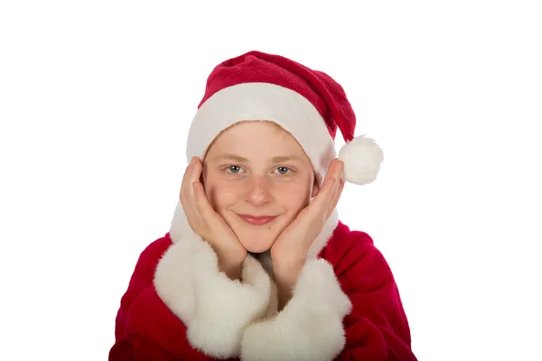 Jongen als santa claus met gezicht op zijn handen — Stockfoto