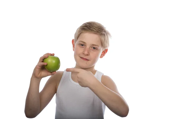 Young boy with a green apple — Stock Photo, Image