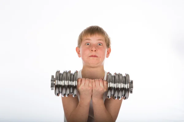 若い男の子のダンベル運動 ストックフォト